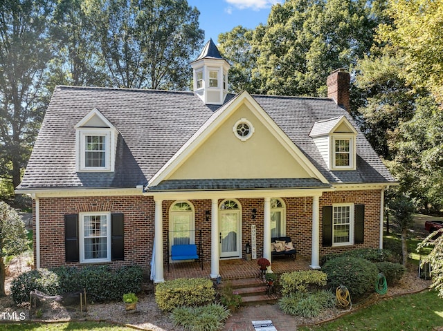 cape cod home with covered porch