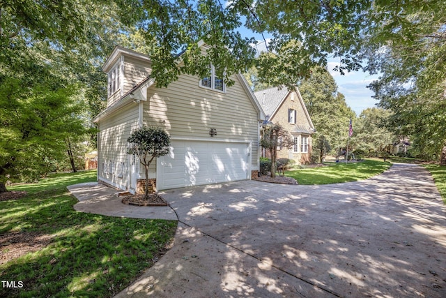 front of property featuring a front lawn and a garage