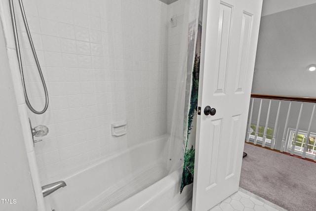 bathroom with tile patterned floors and shower / bath combination with curtain