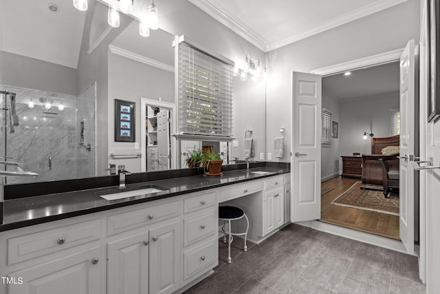 bathroom featuring hardwood / wood-style floors, crown molding, a shower with door, and vanity