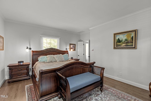 bedroom with wood-type flooring and crown molding