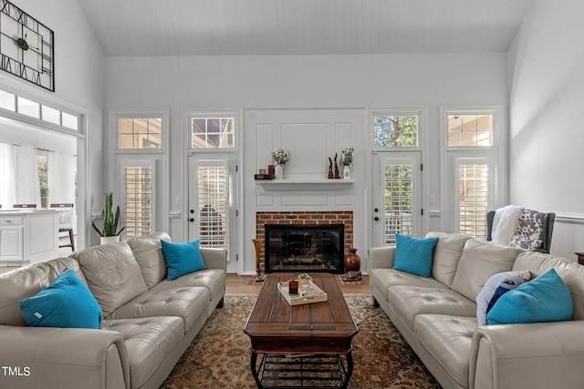 living room with a fireplace and hardwood / wood-style floors