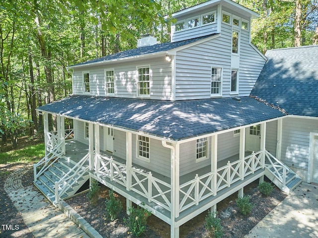 back of house featuring a porch