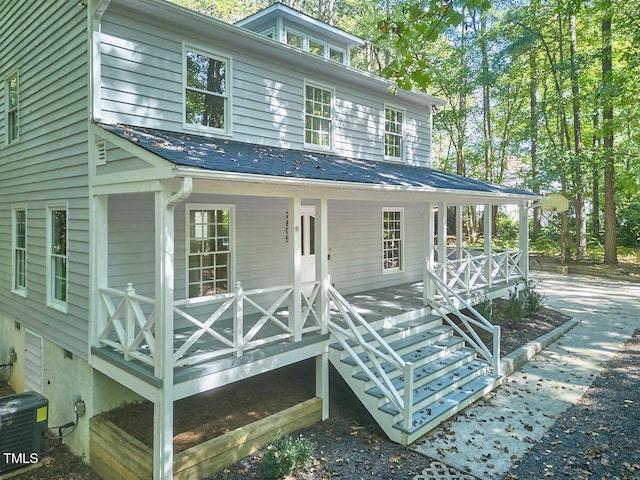 view of front of home featuring a porch and central air condition unit