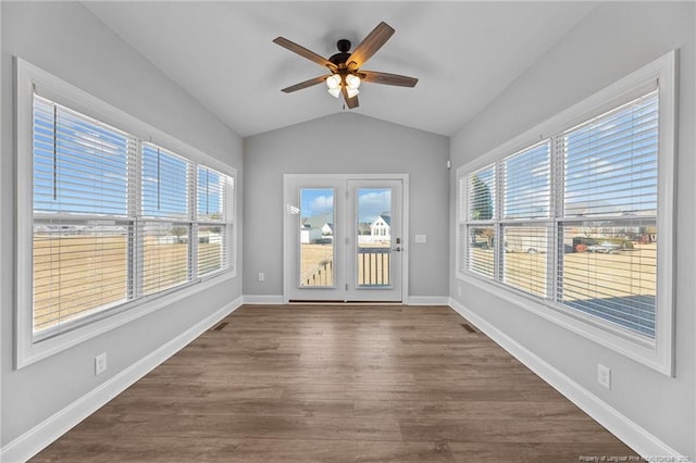 unfurnished sunroom with lofted ceiling, plenty of natural light, and ceiling fan