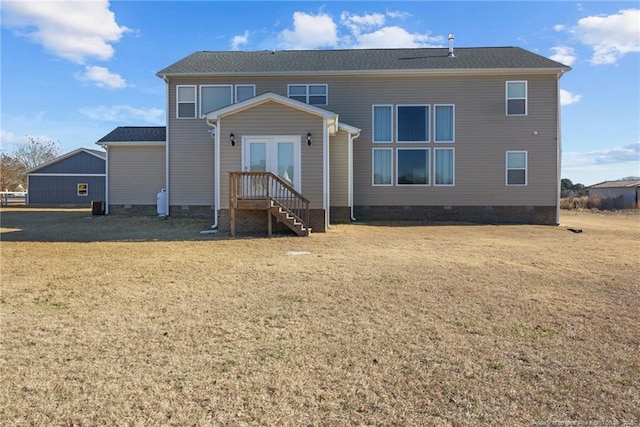 back of house featuring french doors and a yard