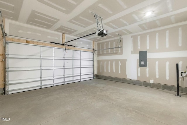 garage featuring electric panel and a garage door opener