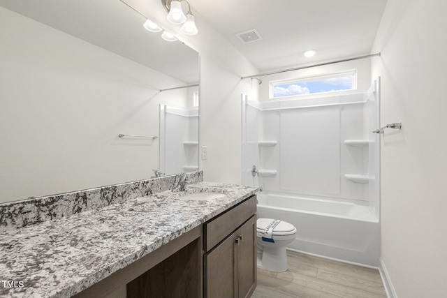 full bathroom featuring bathtub / shower combination, toilet, vanity, and wood-type flooring