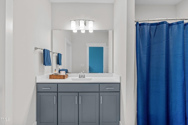 full bathroom with vanity and a shower with shower curtain