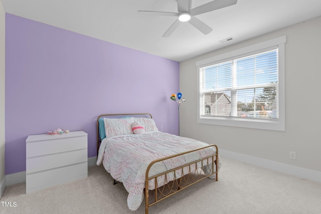 bedroom with a ceiling fan, carpet flooring, visible vents, and baseboards