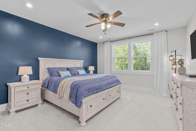 bedroom with recessed lighting, light carpet, a ceiling fan, visible vents, and baseboards