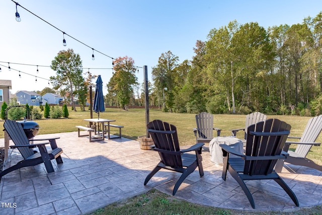 view of patio featuring an outdoor fire pit