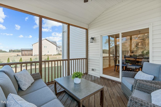 sunroom / solarium with vaulted ceiling