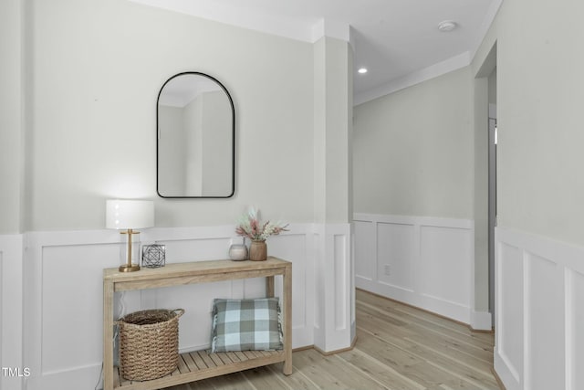 corridor with a wainscoted wall, light wood-type flooring, and recessed lighting