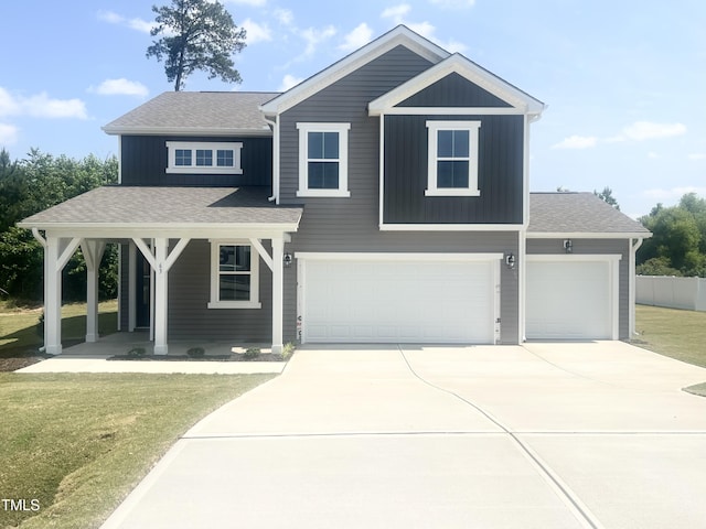 63 Lynn Crest Way, Four Oaks, NC 27524 - view of front of property with a porch, driveway, an attached garage, and a shingled roof