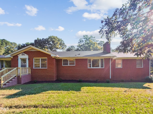 view of side of home featuring a yard