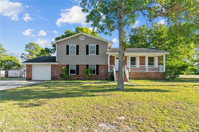 split level home featuring a front yard, a garage, and a porch