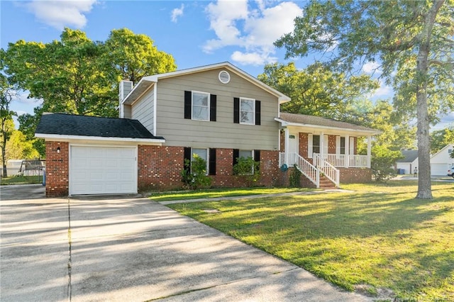 view of front facade with a front yard, a garage, and covered porch