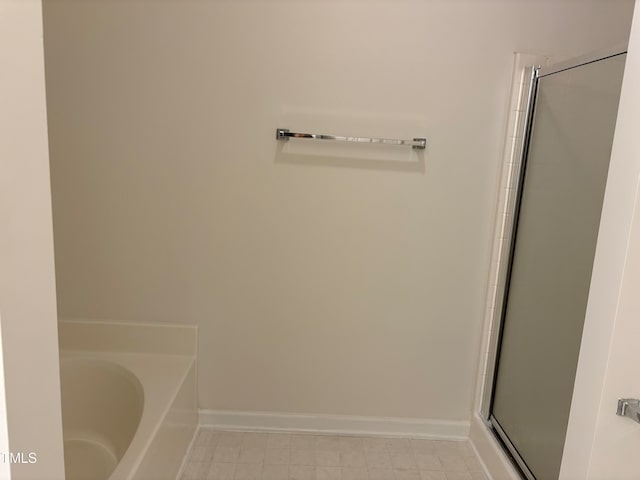 bathroom with separate shower and tub