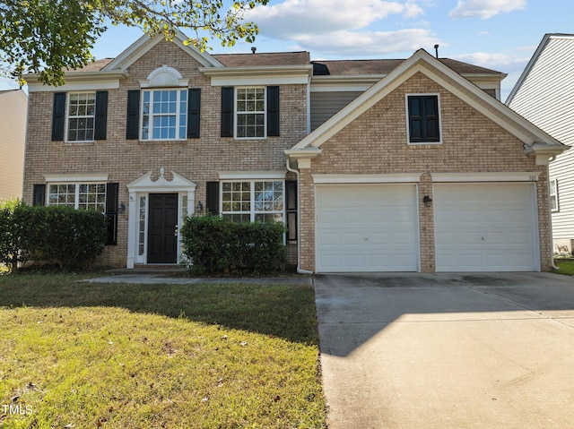 view of front facade featuring a front yard and a garage