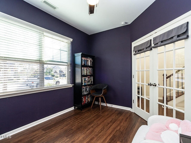 bedroom with ceiling fan, french doors, and dark hardwood / wood-style floors