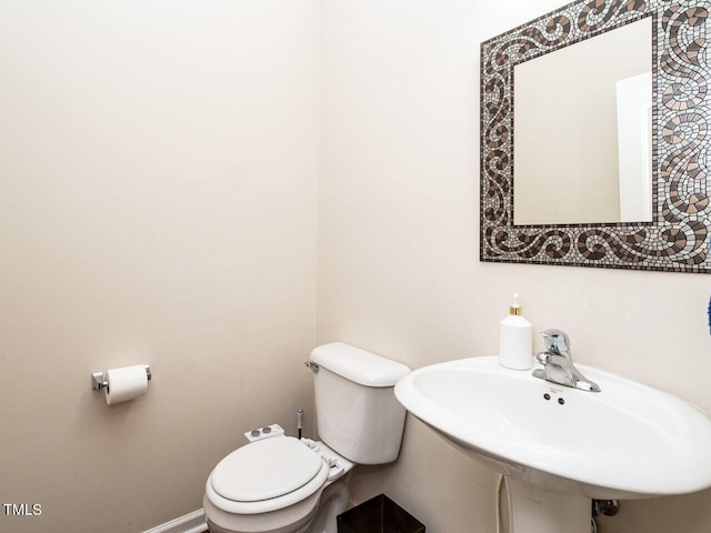 bathroom featuring sink and toilet