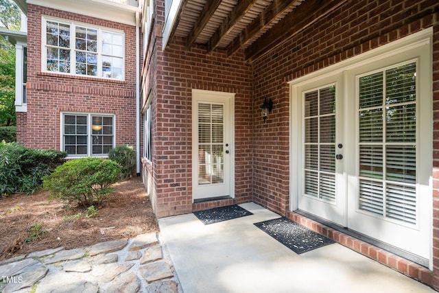 property entrance featuring a patio area