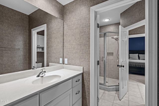 bathroom featuring vanity, tile patterned floors, toilet, and walk in shower