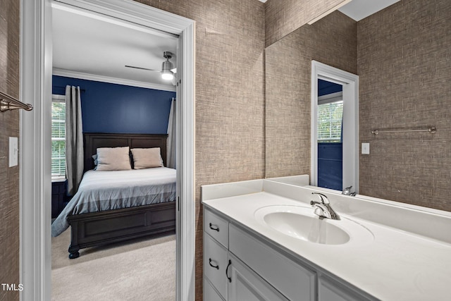 bathroom with vanity, crown molding, and ceiling fan