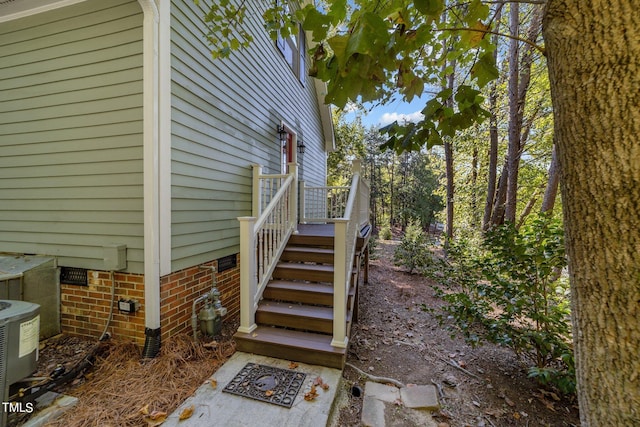 view of side of home featuring central AC unit