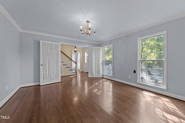 unfurnished room with ornamental molding, a chandelier, and dark hardwood / wood-style flooring