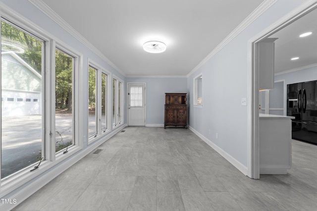 hallway featuring crown molding