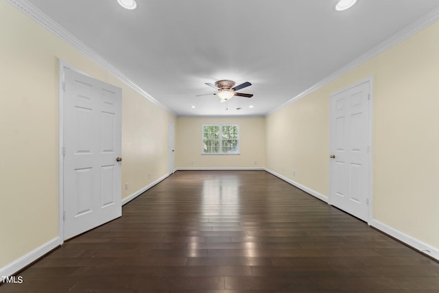 empty room with ceiling fan, dark hardwood / wood-style floors, and crown molding