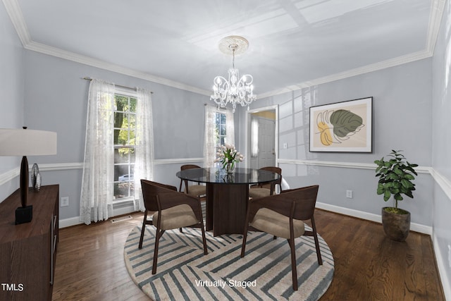 dining area featuring a notable chandelier, crown molding, and dark hardwood / wood-style flooring