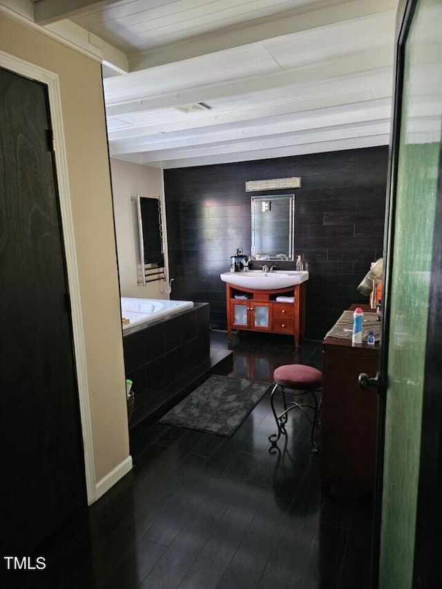 full bathroom with vanity, wood finished floors, and beamed ceiling