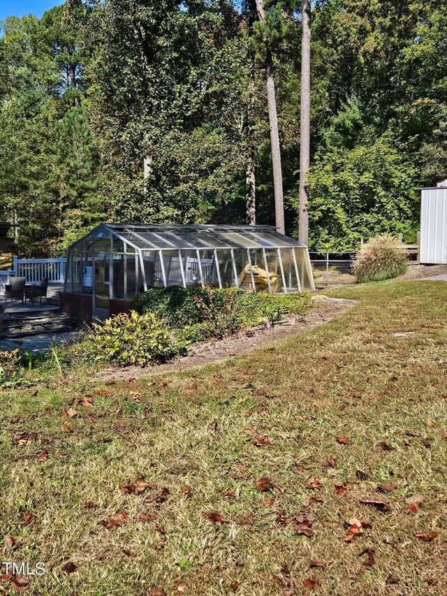 back of house featuring a lawn