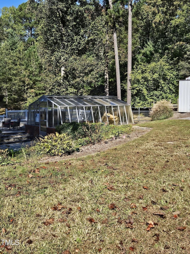 exterior space with an exterior structure, an outbuilding, and a front lawn
