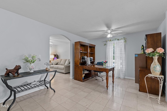 home office featuring ceiling fan and light tile patterned floors