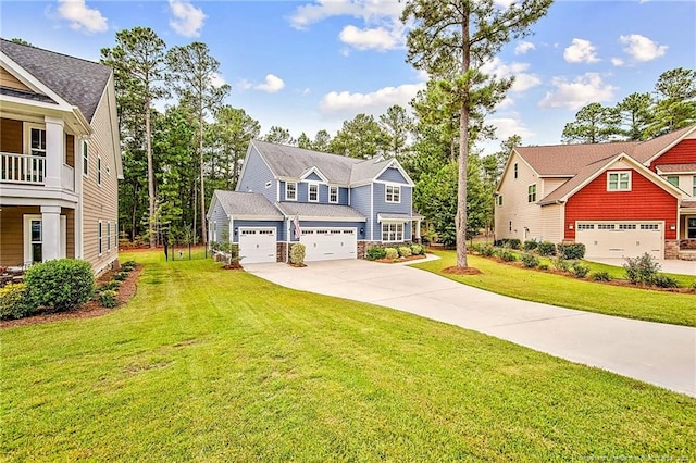 view of front of house featuring a garage and a front yard