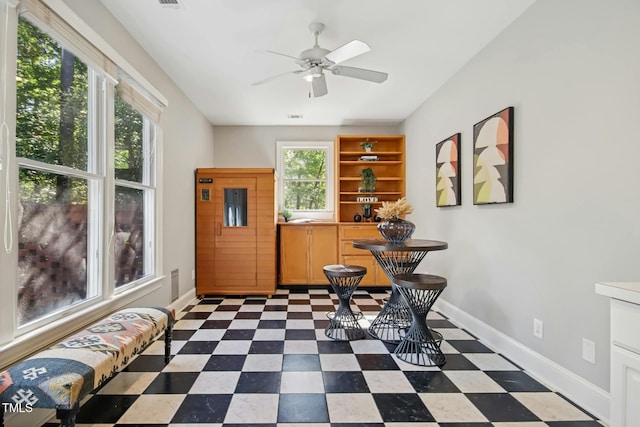 living area featuring ceiling fan