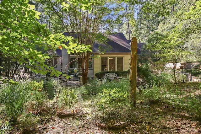 back of property featuring a chimney