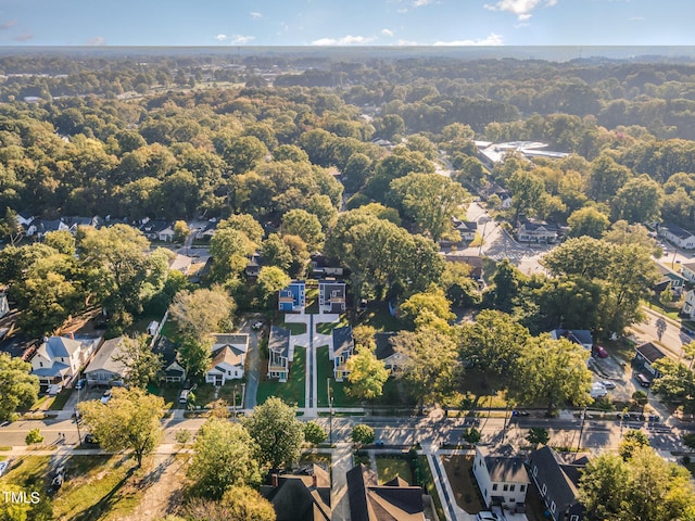 aerial view featuring a view of trees and a residential view