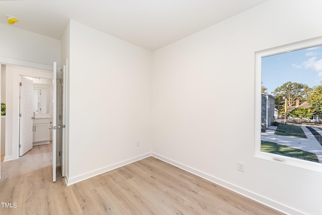 112 N Guthrie Ave Unit A, Durham, NC 27703 - unfurnished room with light wood finished floors and baseboards