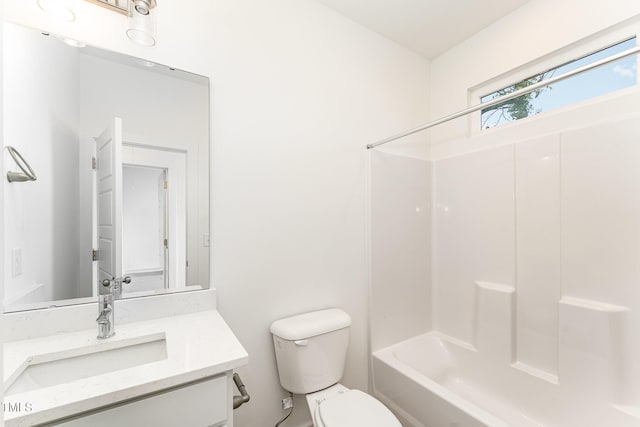 bathroom with toilet, vanity, and bathtub / shower combination