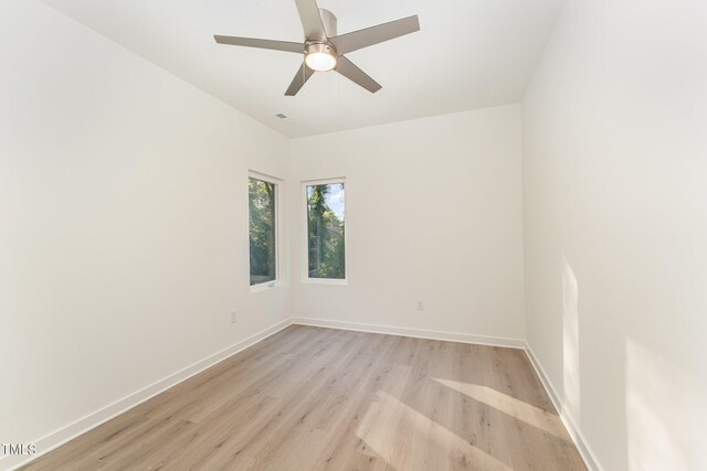 empty room with light hardwood / wood-style floors and ceiling fan