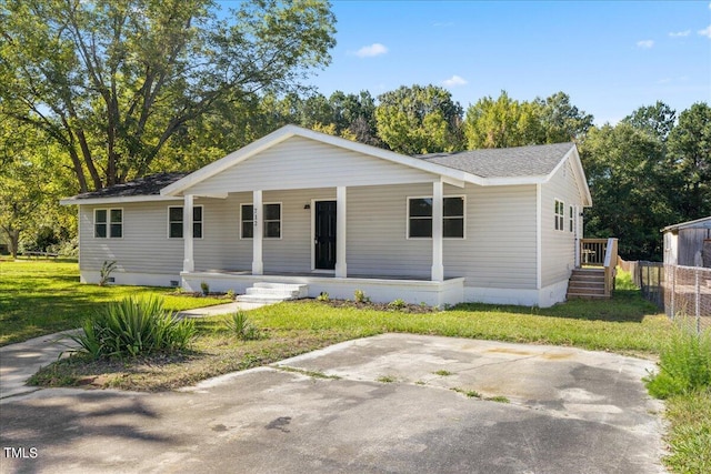 view of front of property with a porch and a front yard