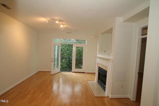 1001 Hillsborough St Unit 304, Raleigh, NC 27603 - unfurnished living room with a fireplace with flush hearth and light wood-style flooring