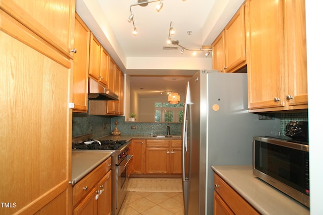 1001 Hillsborough St Unit 304, Raleigh, NC 27603 - kitchen featuring high end stainless steel range oven, under cabinet range hood, decorative backsplash, light tile patterned floors, and light countertops