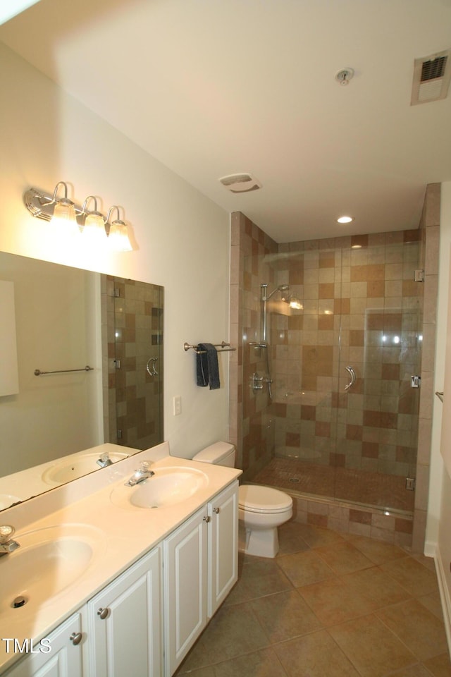 1001 Hillsborough St Unit 304, Raleigh, NC 27603 - bathroom with a shower stall, double vanity, and tile patterned flooring