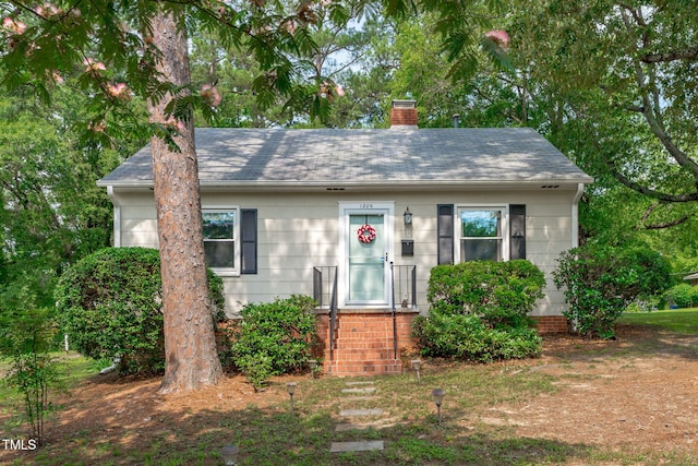 1209 Edgevale Rd, Durham, NC 27701 - view of front of home featuring a chimney and roof with shingles